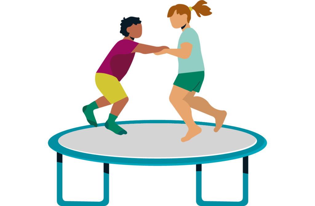 two children playing on a trampoline